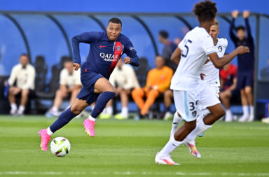 Kylian Mbappe runs with the ball