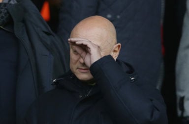 Spurs chairman Daniel Levy with his hand on his face