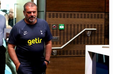 Ange Postecoglou walks towards his press conference